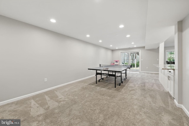 rec room with light colored carpet, baseboards, and recessed lighting