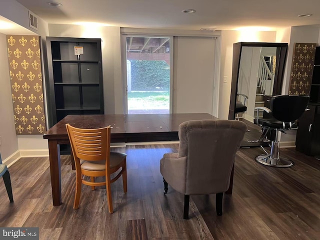 dining room with dark wood-type flooring, baseboards, and visible vents