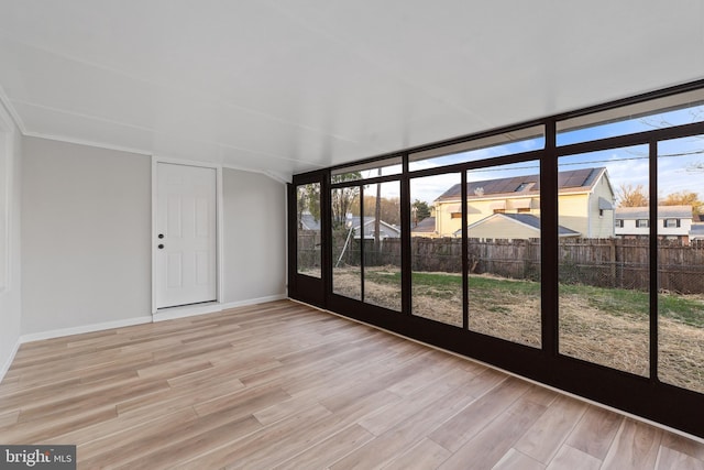 unfurnished sunroom with a wealth of natural light