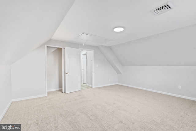 bonus room with baseboards, attic access, carpet floors, visible vents, and lofted ceiling