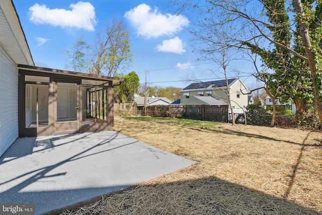 view of yard with a patio and fence
