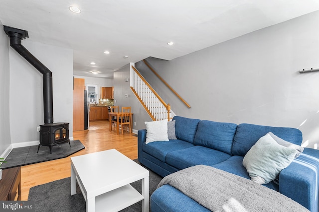 2513 Kimball St, Philadelphia, PA 19146 - living area with light wood-style floors, a wood stove, recessed lighting, stairway, and baseboards