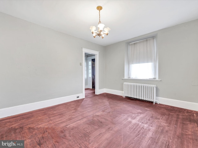 215 Biddle St, Gordon, PA 17936 - empty room with radiator heating unit, plenty of natural light, baseboards, and an inviting chandelier