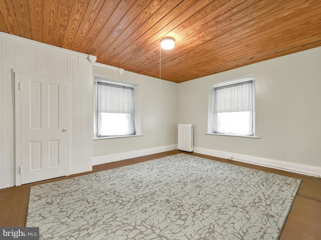215 Biddle St, Gordon, PA 17936 - empty room with wooden ceiling, baseboards, radiator heating unit, and wood finished floors