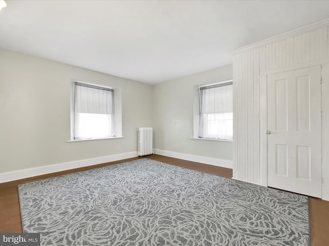 215 Biddle St, Gordon, PA 17936 - interior space featuring radiator heating unit, baseboards, and wood finished floors