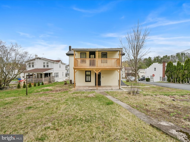 215 Biddle St, Gordon, PA 17936 - rear view of property featuring a yard, covered porch, driveway, and a balcony