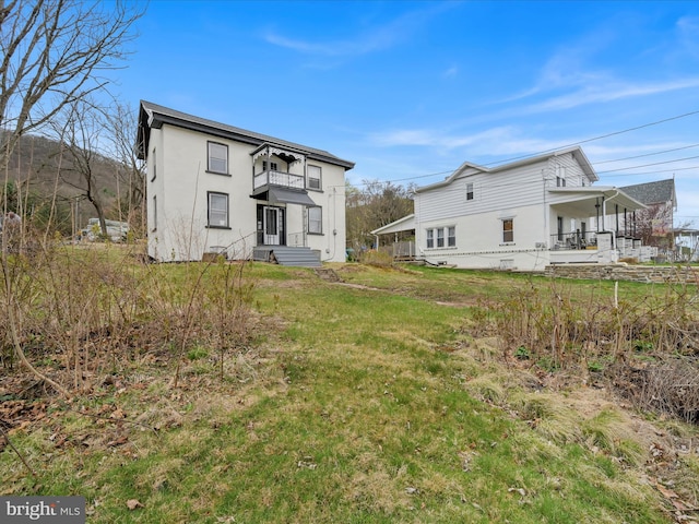 215 Biddle St, Gordon, PA 17936 - back of house with a balcony and stucco siding