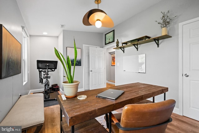 office space with recessed lighting, baseboards, and light wood-style floors