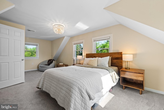 bedroom with an inviting chandelier, carpet floors, baseboards, vaulted ceiling, and visible vents