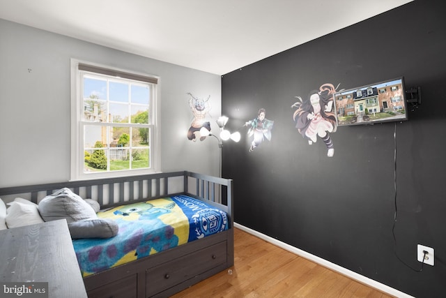 bedroom featuring wood finished floors