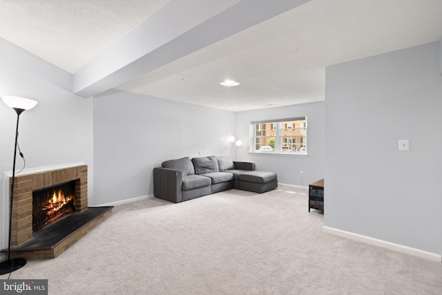 living area featuring baseboards, carpet flooring, and a brick fireplace