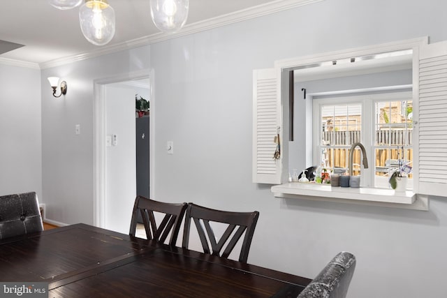 dining area featuring ornamental molding