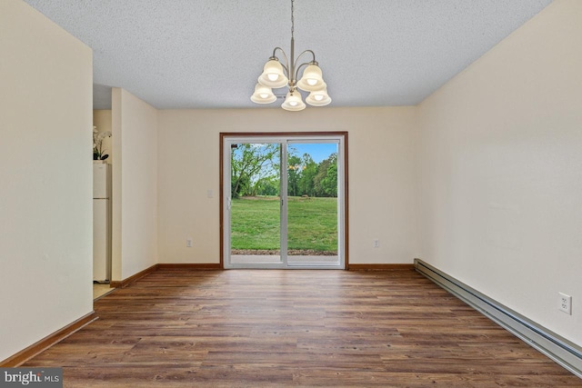 392 Walker Way, Timberville, VA 22853 - spare room with baseboard heating, a chandelier, a textured ceiling, wood finished floors, and baseboards