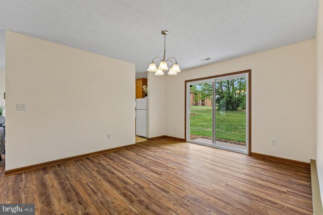 392 Walker Way, Timberville, VA 22853 - unfurnished room featuring wood finished floors, a chandelier, baseboards, and a textured ceiling