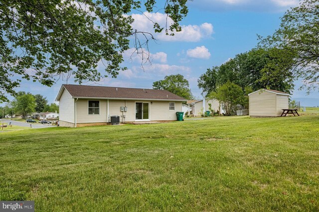 392 Walker Way, Timberville, VA 22853 - back of house featuring cooling unit, a storage unit, a yard, and an outdoor structure