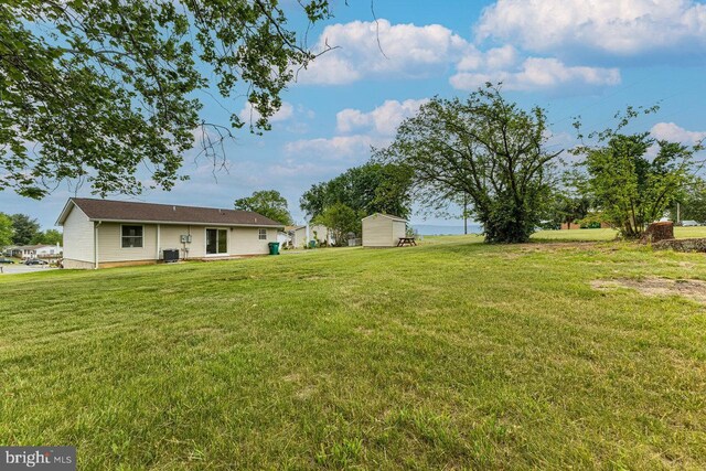 392 Walker Way, Timberville, VA 22853 - view of grassy yard with a shed, an outdoor structure, and central air condition unit