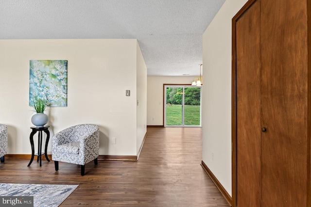 392 Walker Way, Timberville, VA 22853 - hall with a textured ceiling, wood finished floors, and baseboards