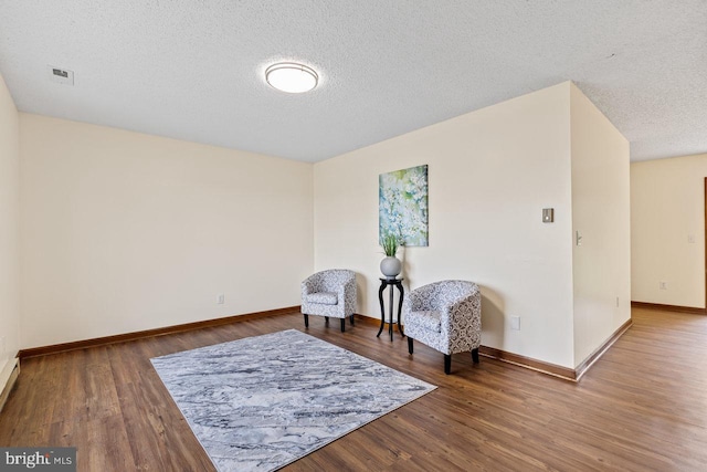 392 Walker Way, Timberville, VA 22853 - living area with a textured ceiling, baseboards, and wood finished floors