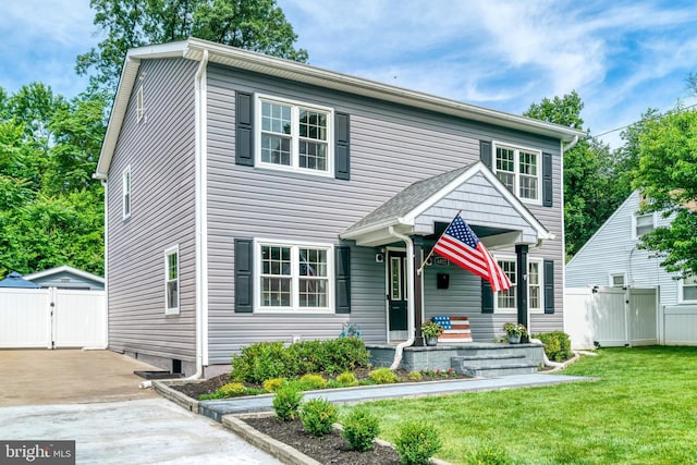 6022 Rixey Dr, Alexandria, VA 22303 - view of front facade with a gate and concrete driveway