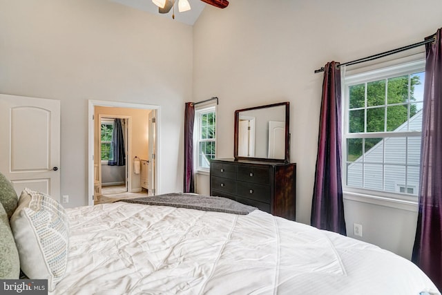 6022 Rixey Dr, Alexandria, VA 22303 - bedroom featuring multiple windows, high vaulted ceiling, connected bathroom, and a ceiling fan