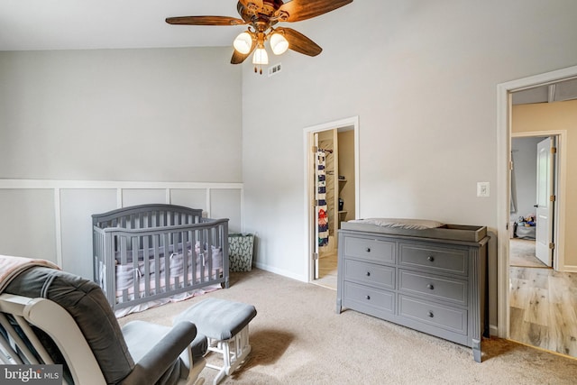 6022 Rixey Dr, Alexandria, VA 22303 - bedroom featuring high vaulted ceiling, a walk in closet, ceiling fan, and carpet floors
