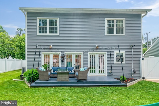 6022 Rixey Dr, Alexandria, VA 22303 - rear view of house with french doors, outdoor lounge area, a fenced backyard, a wooden deck, and a gate
