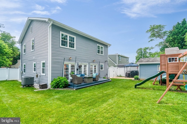 6022 Rixey Dr, Alexandria, VA 22303 - rear view of property with a playground, outdoor lounge area, and a fenced backyard