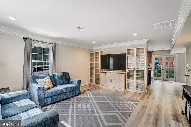 6022 Rixey Dr, Alexandria, VA 22303 - living area featuring french doors, light wood-style flooring, crown molding, and recessed lighting
