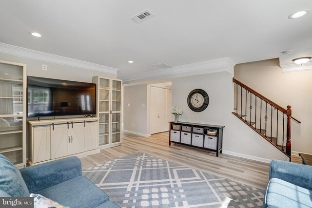 6022 Rixey Dr, Alexandria, VA 22303 - living area with ornamental molding, light wood-type flooring, stairs, and recessed lighting