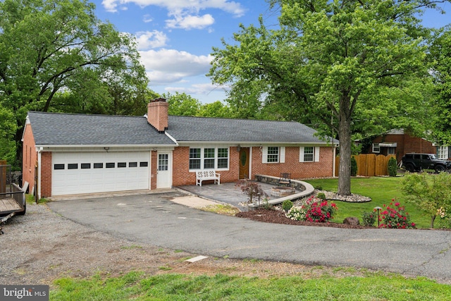 8412 Impalla Dr, Manassas, VA 20110 - ranch-style house featuring a garage, driveway, brick siding, a chimney, and a shingled roof
