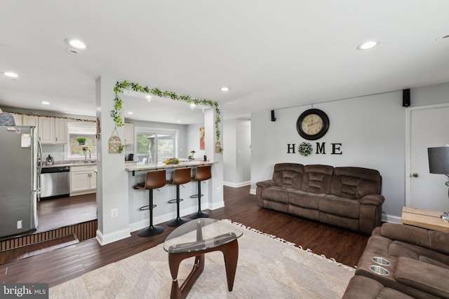 8412 Impalla Dr, Manassas, VA 20110 - living area with baseboards, recessed lighting, and dark wood-style flooring