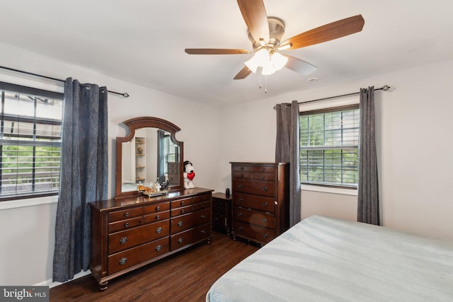 8412 Impalla Dr, Manassas, VA 20110 - bedroom featuring dark wood-style flooring, a ceiling fan, and baseboards
