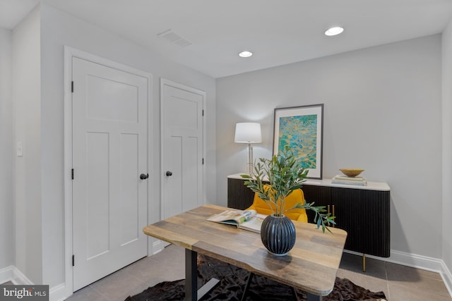 office space with baseboards, visible vents, light tile patterned flooring, and recessed lighting