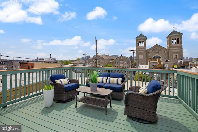 wooden deck featuring outdoor lounge area
