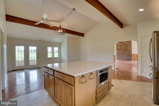 17634 Bruehl Rd, Upperco, MD 21155 - kitchen with freestanding refrigerator, ceiling fan, open floor plan, light countertops, and a center island