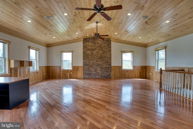 17634 Bruehl Rd, Upperco, MD 21155 - unfurnished living room with a wainscoted wall, ornamental molding, wood finished floors, a ceiling fan, and wooden walls