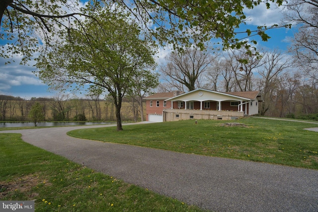 17634 Bruehl Rd, Upperco, MD 21155 - view of front of house with a water view, an attached garage, a front lawn, driveway, and crawl space