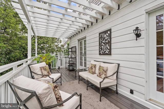 deck with an outdoor hangout area and a pergola