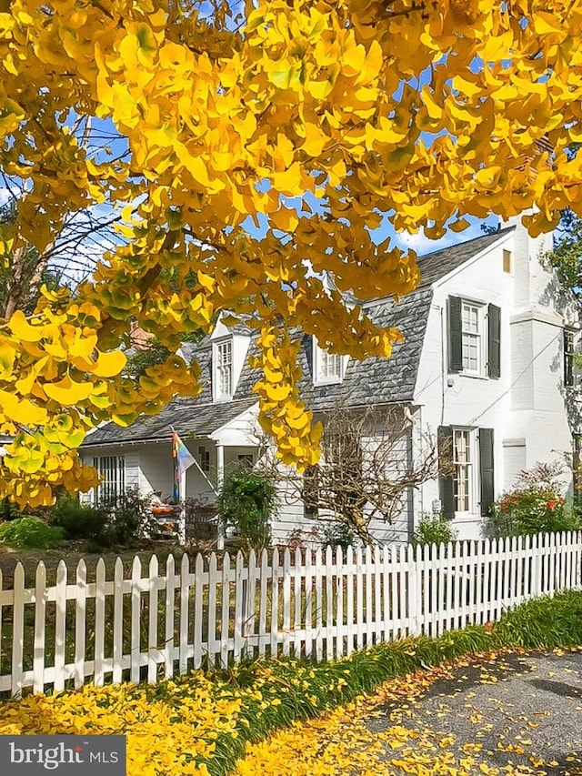 view of side of home with a fenced front yard