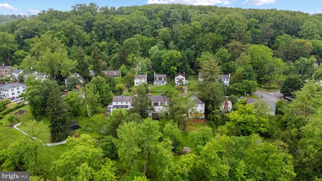 aerial overview of property's location featuring a heavily wooded area