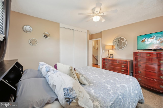 bedroom with carpet floors and a ceiling fan