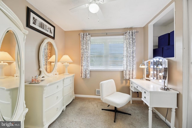 sitting room with visible vents, baseboards, ceiling fan, and light colored carpet