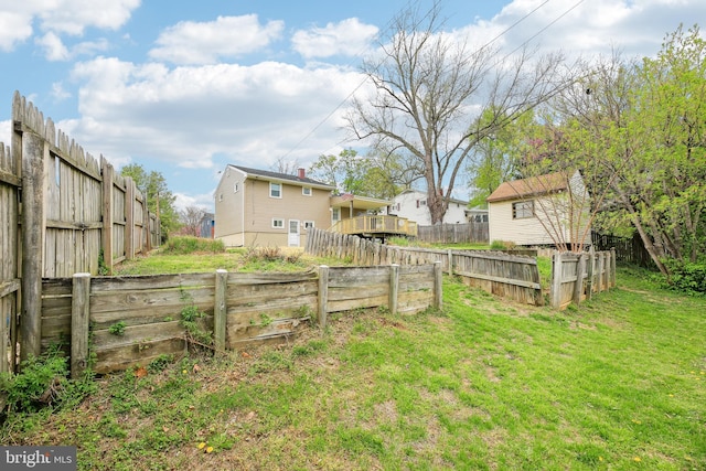 view of yard featuring a fenced backyard and an outdoor structure
