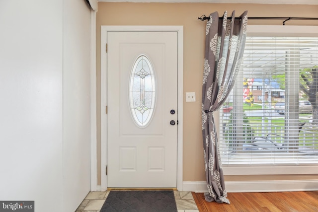 entryway featuring a wealth of natural light and baseboards