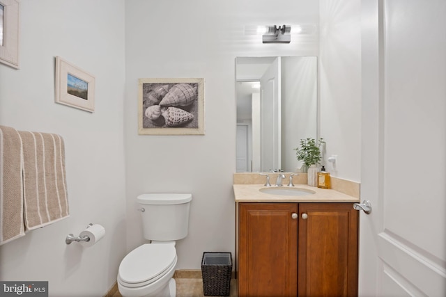 bathroom with toilet and vanity