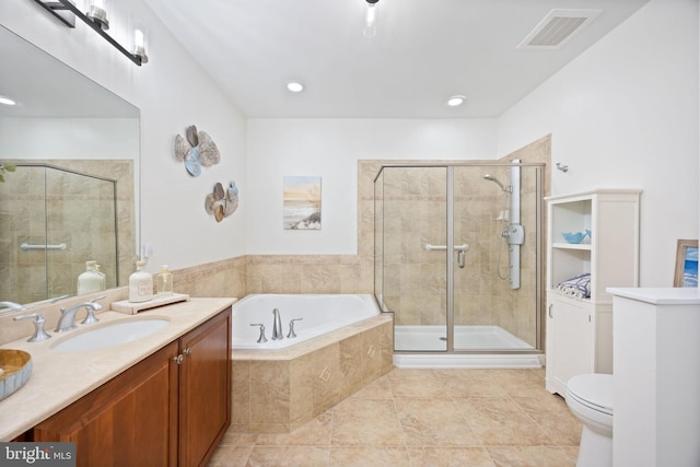 bathroom with visible vents, vanity, a bath, and a shower stall