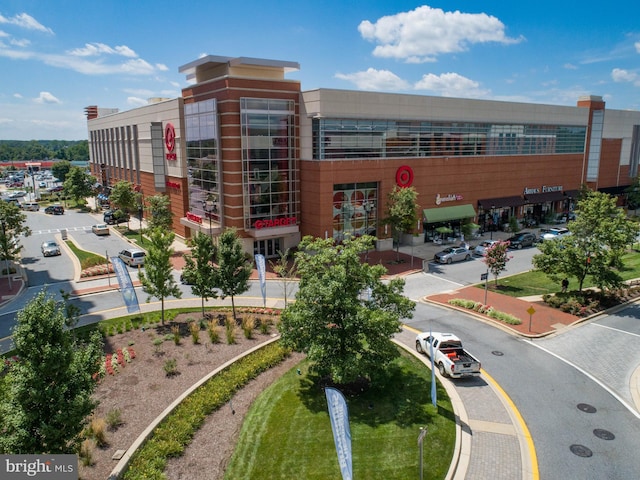 view of building exterior featuring uncovered parking