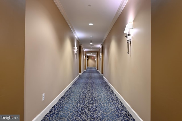 hall with crown molding, baseboards, and recessed lighting