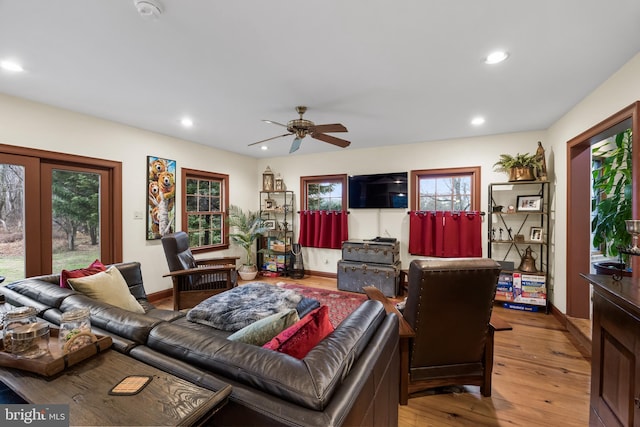 living room with baseboards, recessed lighting, hardwood / wood-style flooring, and a ceiling fan