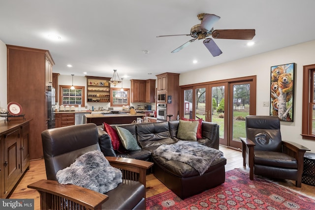 living room featuring light wood finished floors, recessed lighting, and ceiling fan